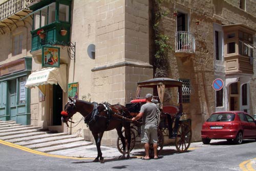 Horse and cart cabs or taxis for sightseeing or getting around Valletta